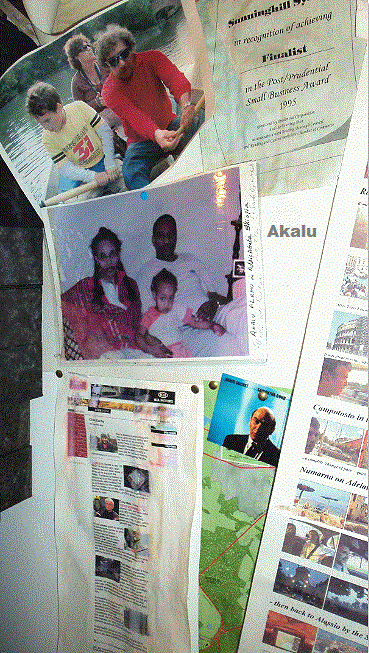 Akalu and family on our office wall. Certificate is 1995.