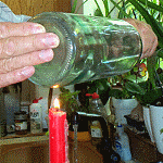 the bottle is cut with a scratch, a candle, and cold water